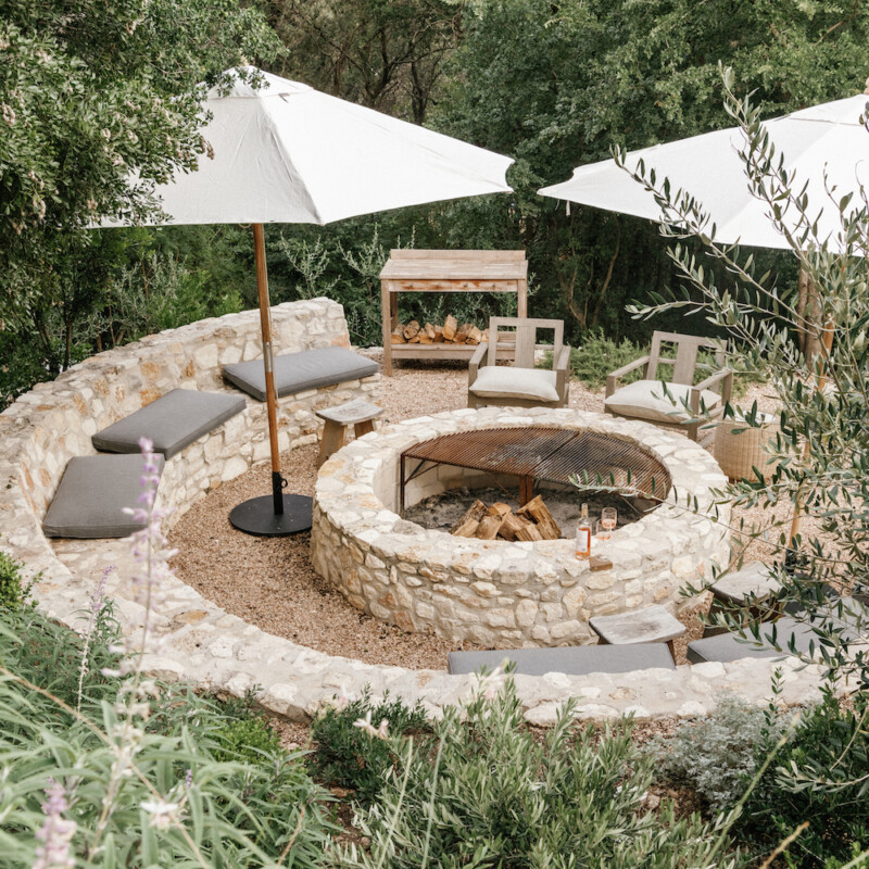 camille styles backyard firepit with umbrellas